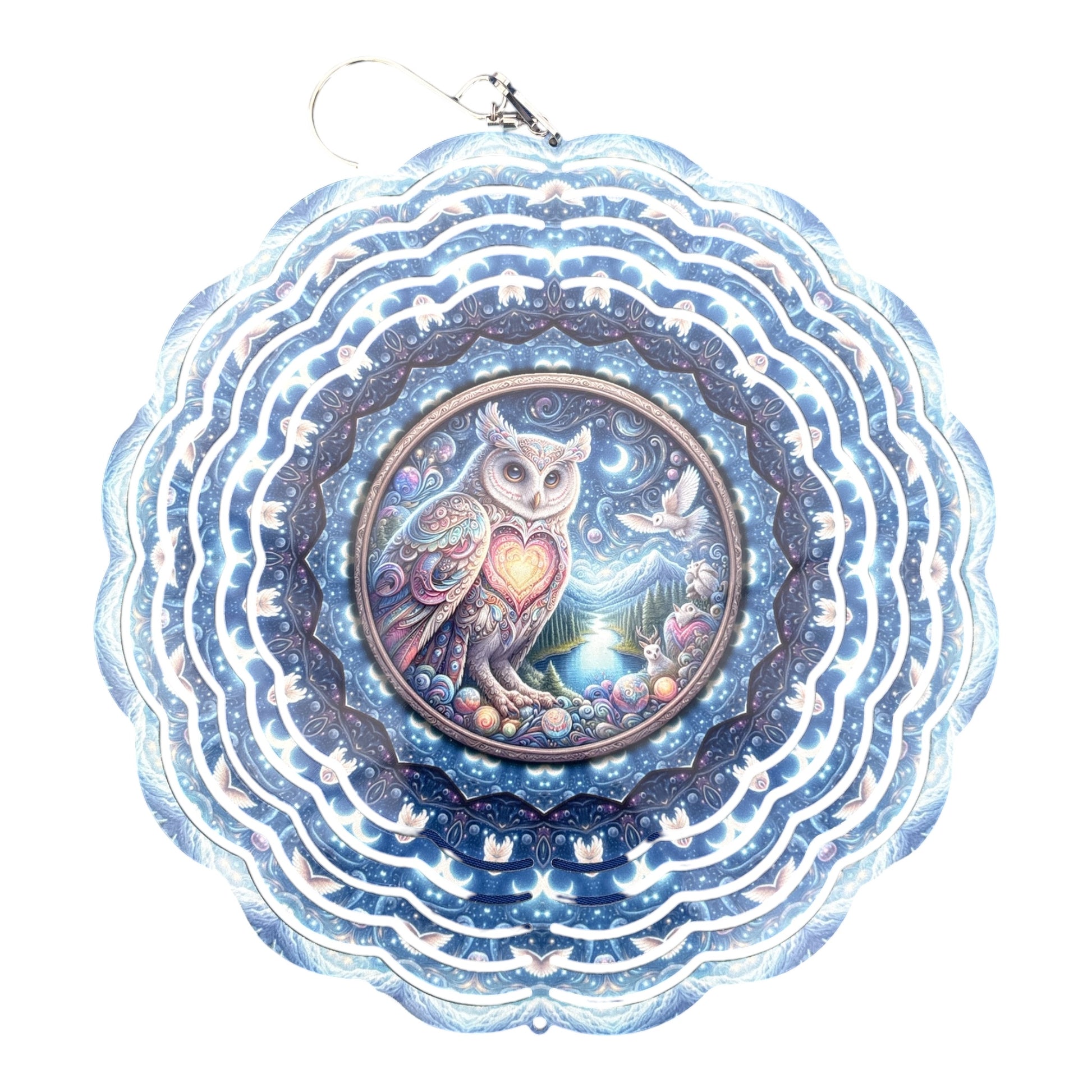 A circular hanging ornament with a scalloped blue and white outer border and a central owl illustration. The owl artwork shows a white owl holding a glowing heart, surrounded by stars, moons, birds, and colorful floral details, with a silver hanging loop at the top.